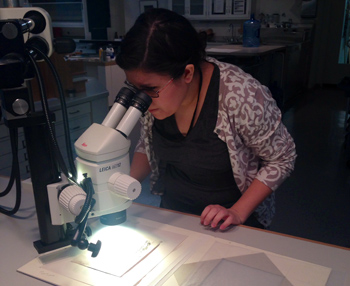 Sandra Racek with a microscope