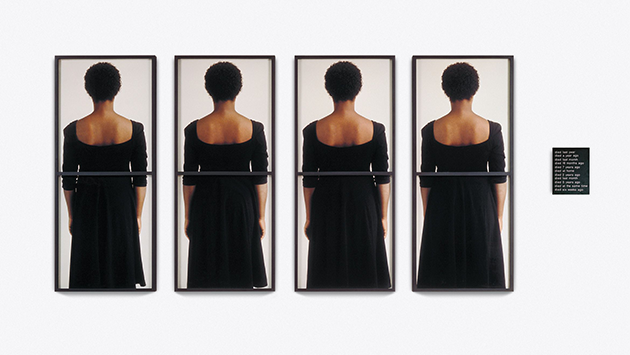 "Time Piece" 1990 by Lorna Simpson. An image of the back of a Black woman in a black dress. Repeated four times with a black plaque next to it.