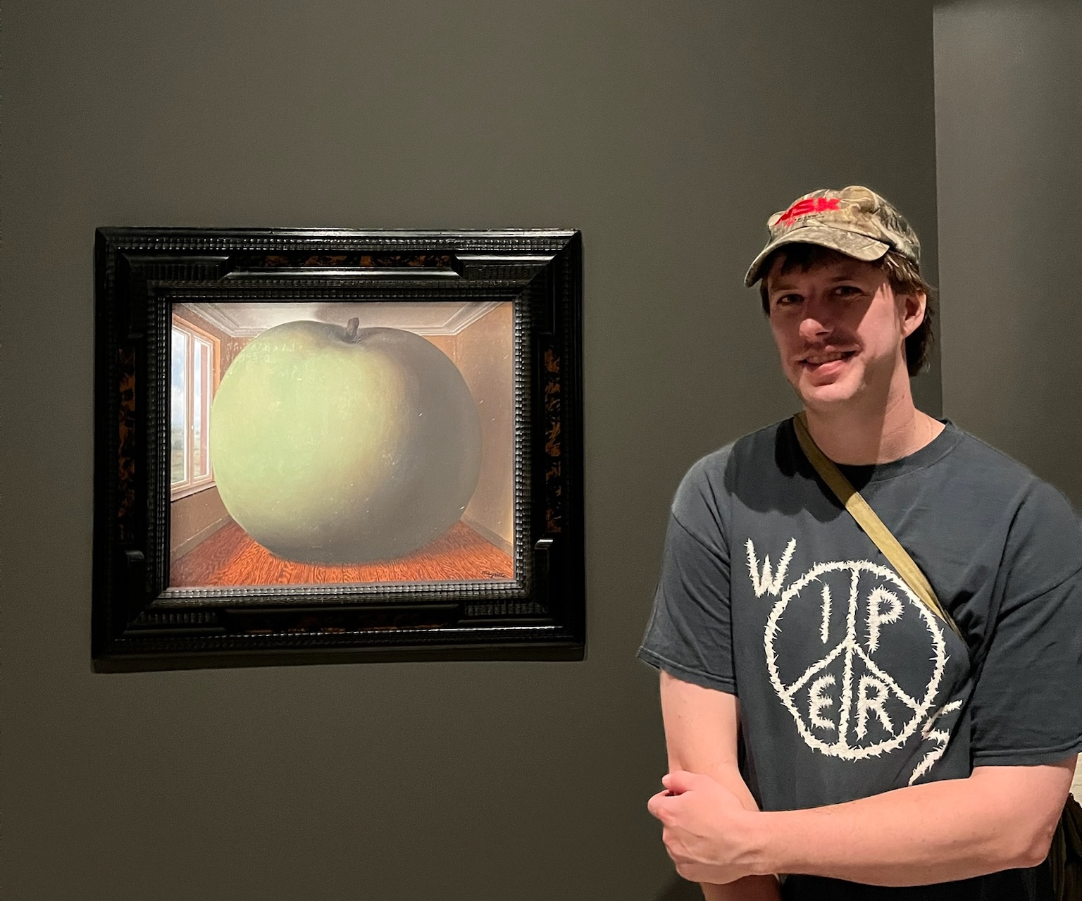 Jake Waits in front of a painting